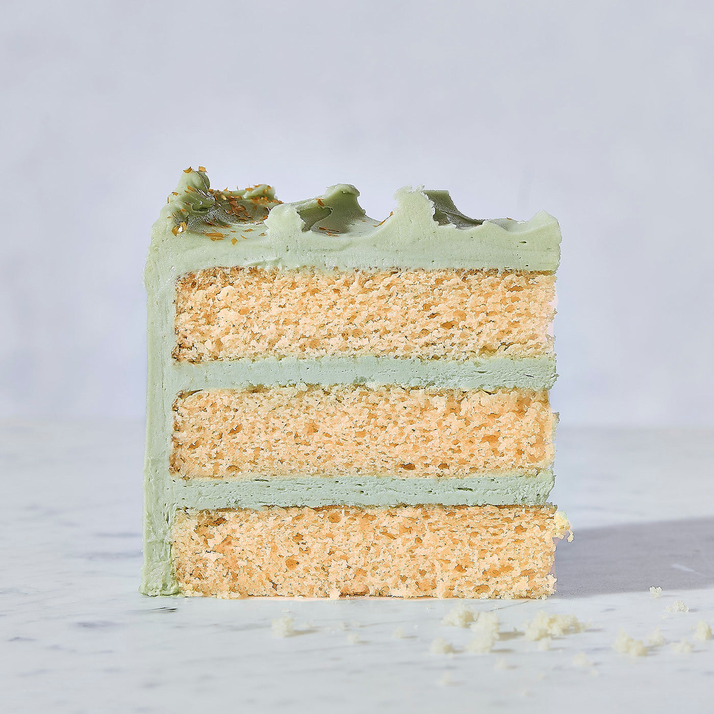 vanilla cake with coconut matcha frosting